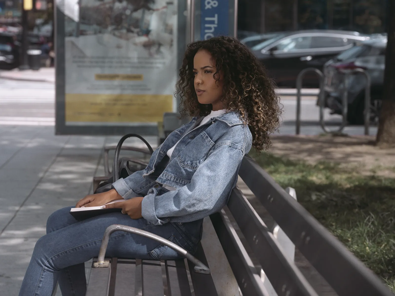 a woman sitting on a bench