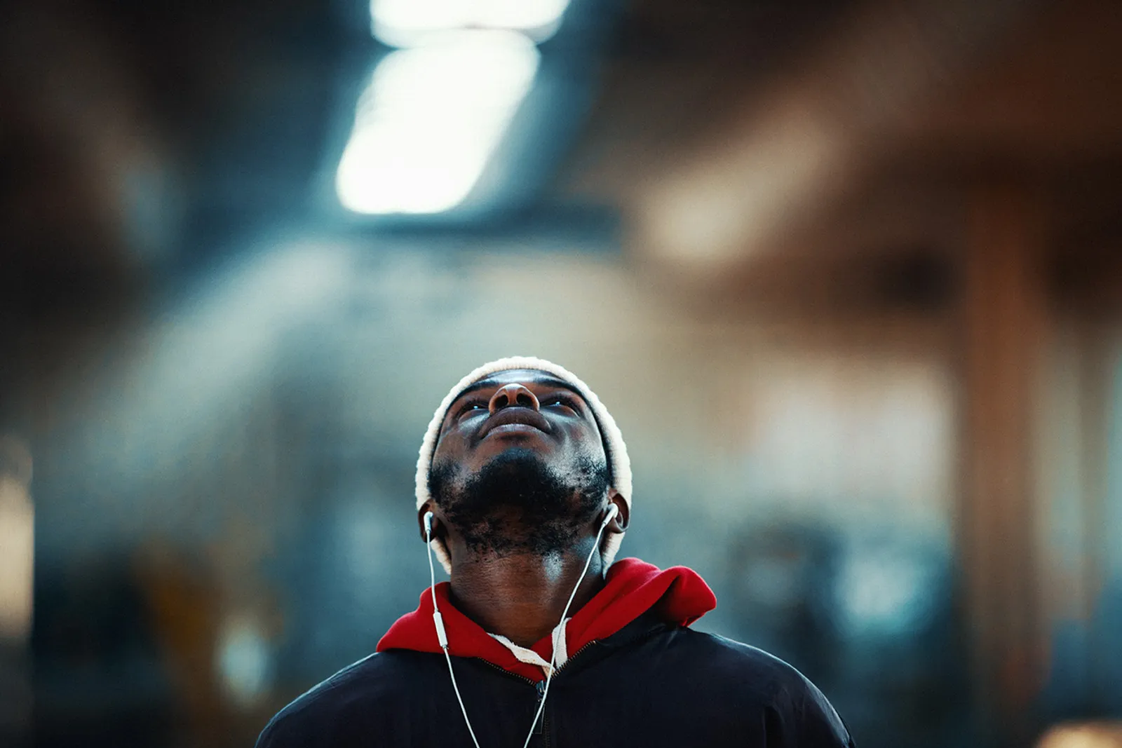 Man wearing headphones and tilting his head up
