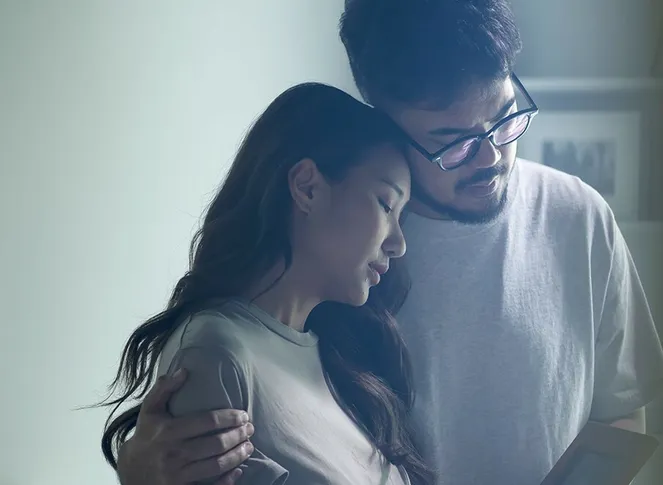 Man and woman hugging each other