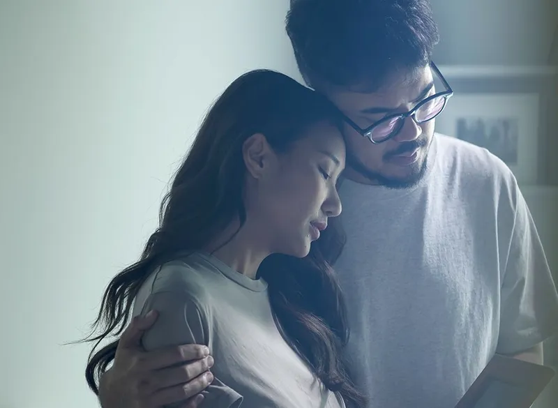 Man and woman hugging each other
